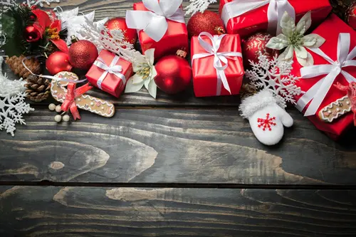 Two boys sitting in an open suitcase pretending to be airplanes